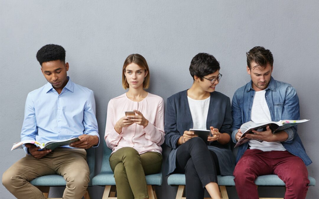 Indoor shot of interracial students sit near classroom going to pass exam, worry before this importa